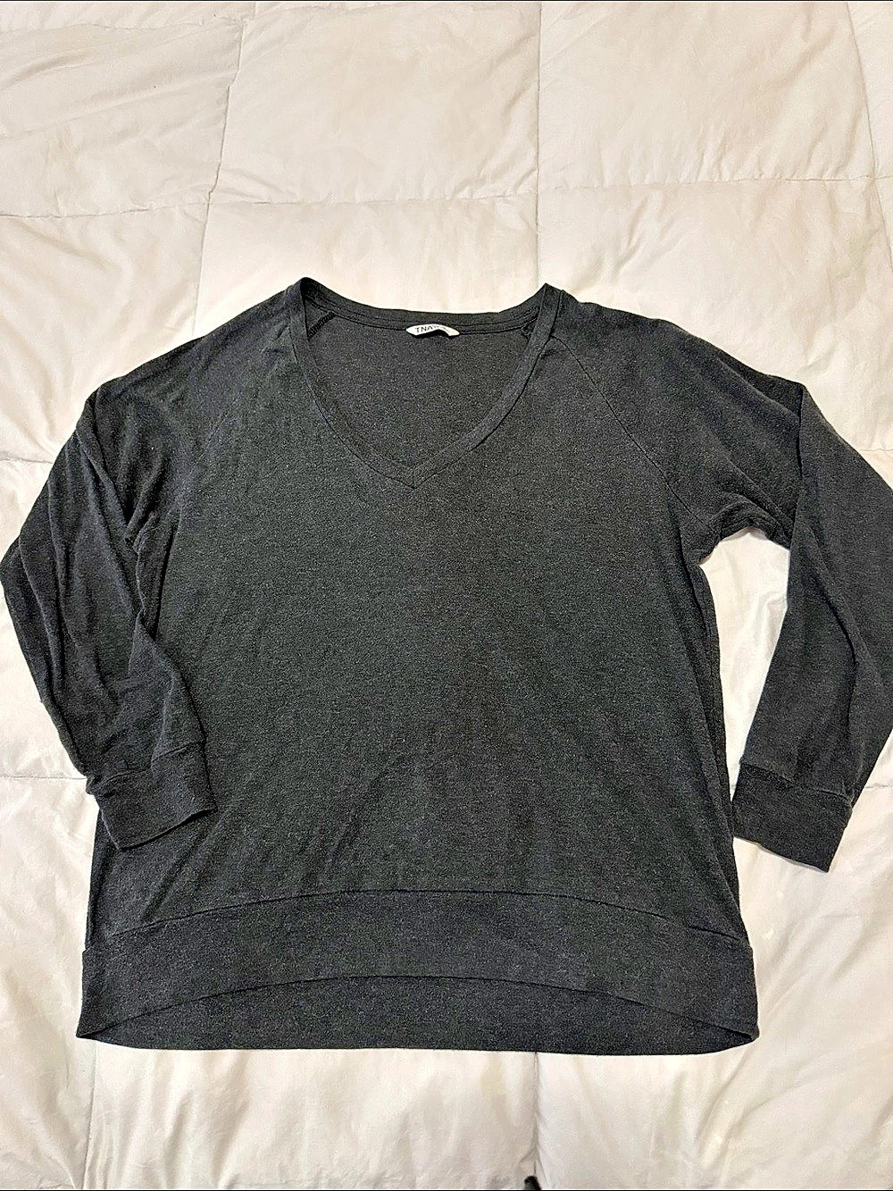 Charcoal gray heathered V-Neck from TNA, an Aritzia brand.